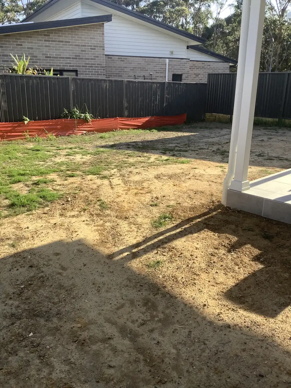 Backyard soil levelled and prepared, ready for new turf